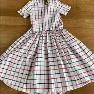 Rosie Assoulin White Label with Blue and Red Geometric Logo